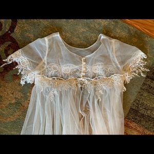 Wedding dress train with pull-over bodice.
